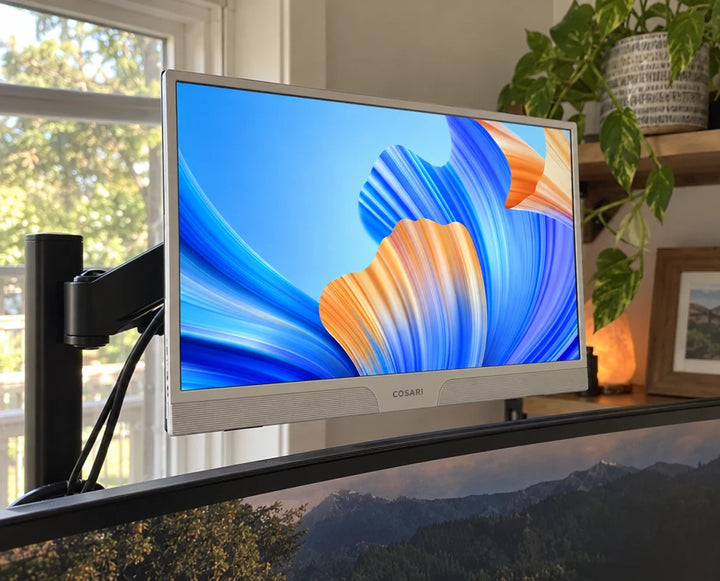Mounted on a VESA arm above my main ultrawide